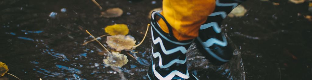 wellies-splashing-in-the-rain.-photo-daiga-ellaby